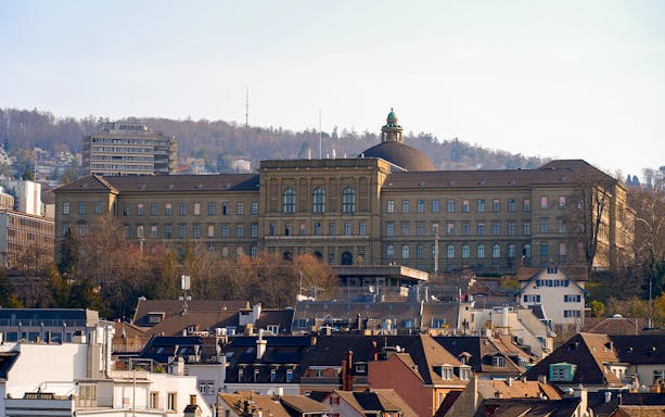 Zurich cityscape with ETH Zurich main building in the background.
