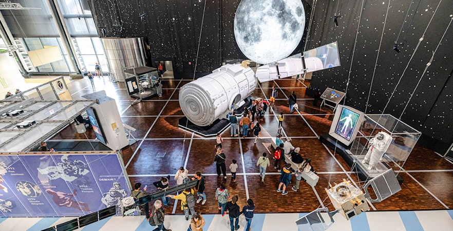 Interior view of Science & Industry Museum Paris, showcasing interactive exhibits and modern architecture.