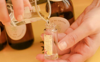 Perfume being poured into a Fragonard bottle during Opéra Garnier visit.