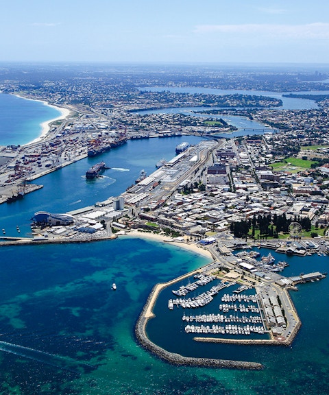 Aerial view of Fremantle Port and marina with surrounding cityscape.