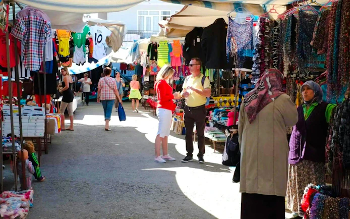 Guests browsing stalls at Manavgat local bazaar, Turkey.