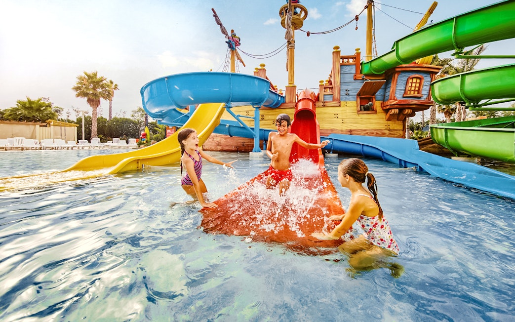 Children playing on water slides at Caribe Aquatic Park.