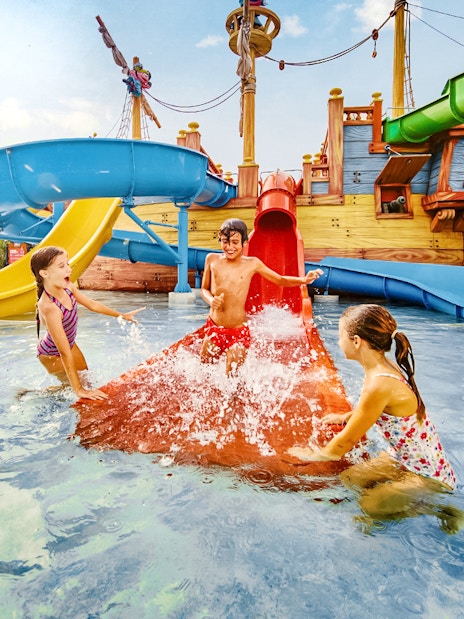 Children playing on water slides at Caribe Aquatic Park.