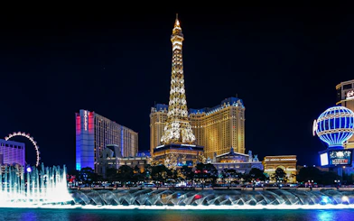 Eiffel Tower replica and fountain show at night, Las Vegas Strip.