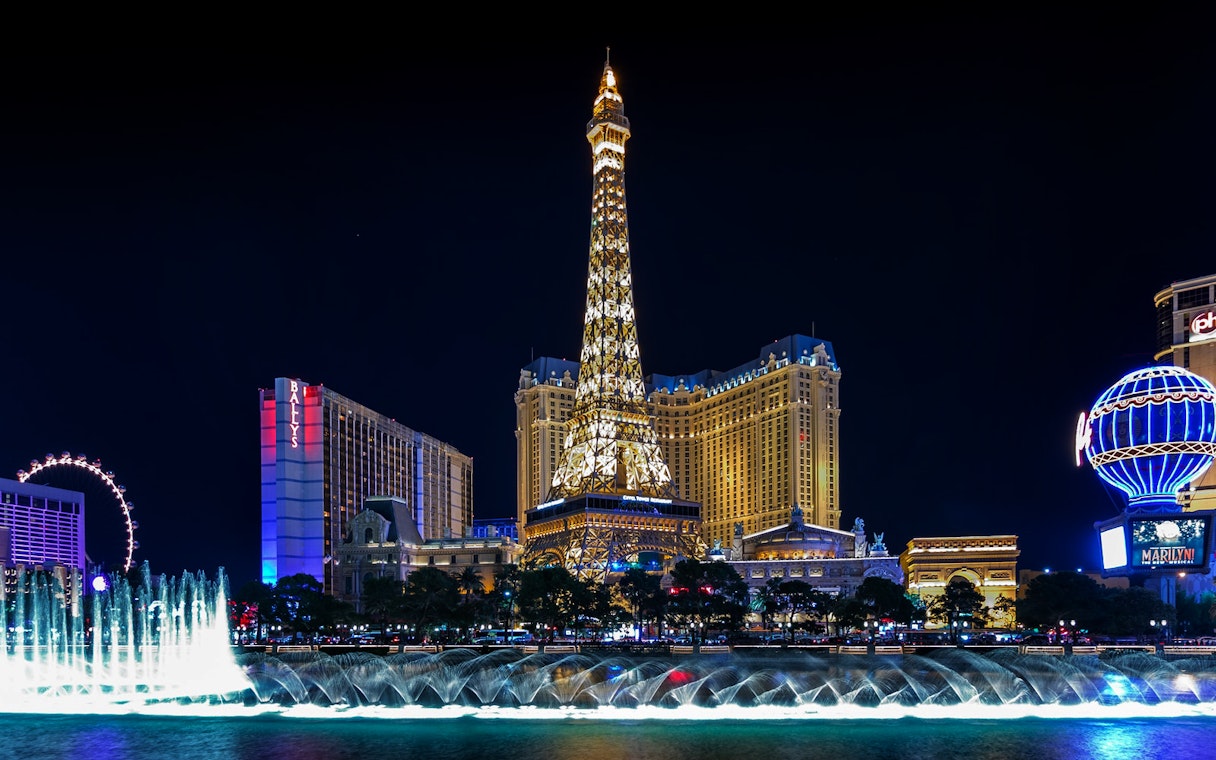Eiffel Tower replica and fountain show at night, Las Vegas Strip.