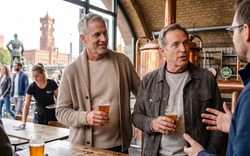 Group enjoying beer at a Berlin brewery during Oktoberfest walking tour.