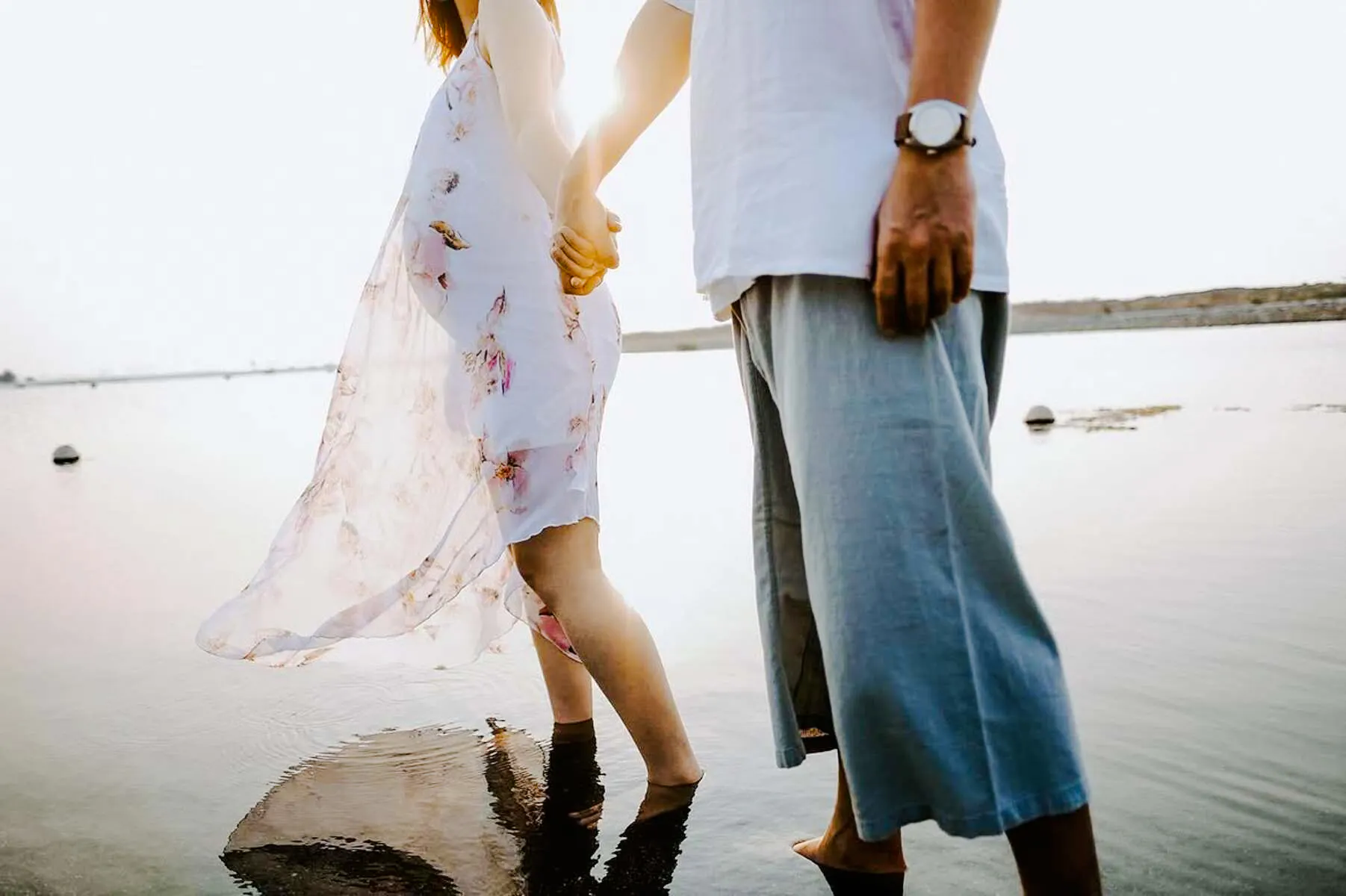 Couple holding hands during a professional photoshoot in Jakarta by Viufinder.