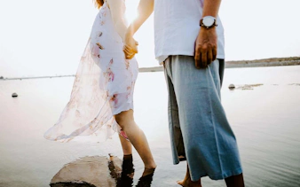 Couple holding hands during a professional photoshoot in Jakarta by Viufinder.