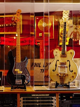 Three iconic guitars displayed at the Irish Rock N Roll Museum Experience in Dublin.