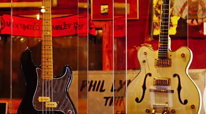 Three iconic guitars displayed at the Irish Rock N Roll Museum Experience in Dublin.