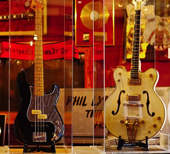 Three iconic guitars displayed at the Irish Rock N Roll Museum Experience in Dublin.