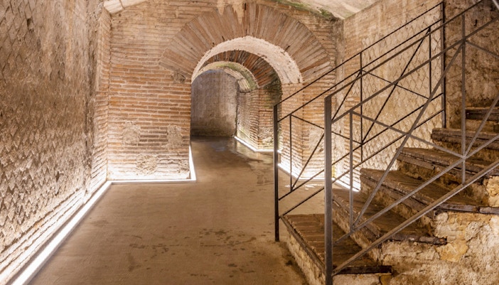 Naples underground tour showcasing Greek Roman theater ruins at Napoli Sotterranea.