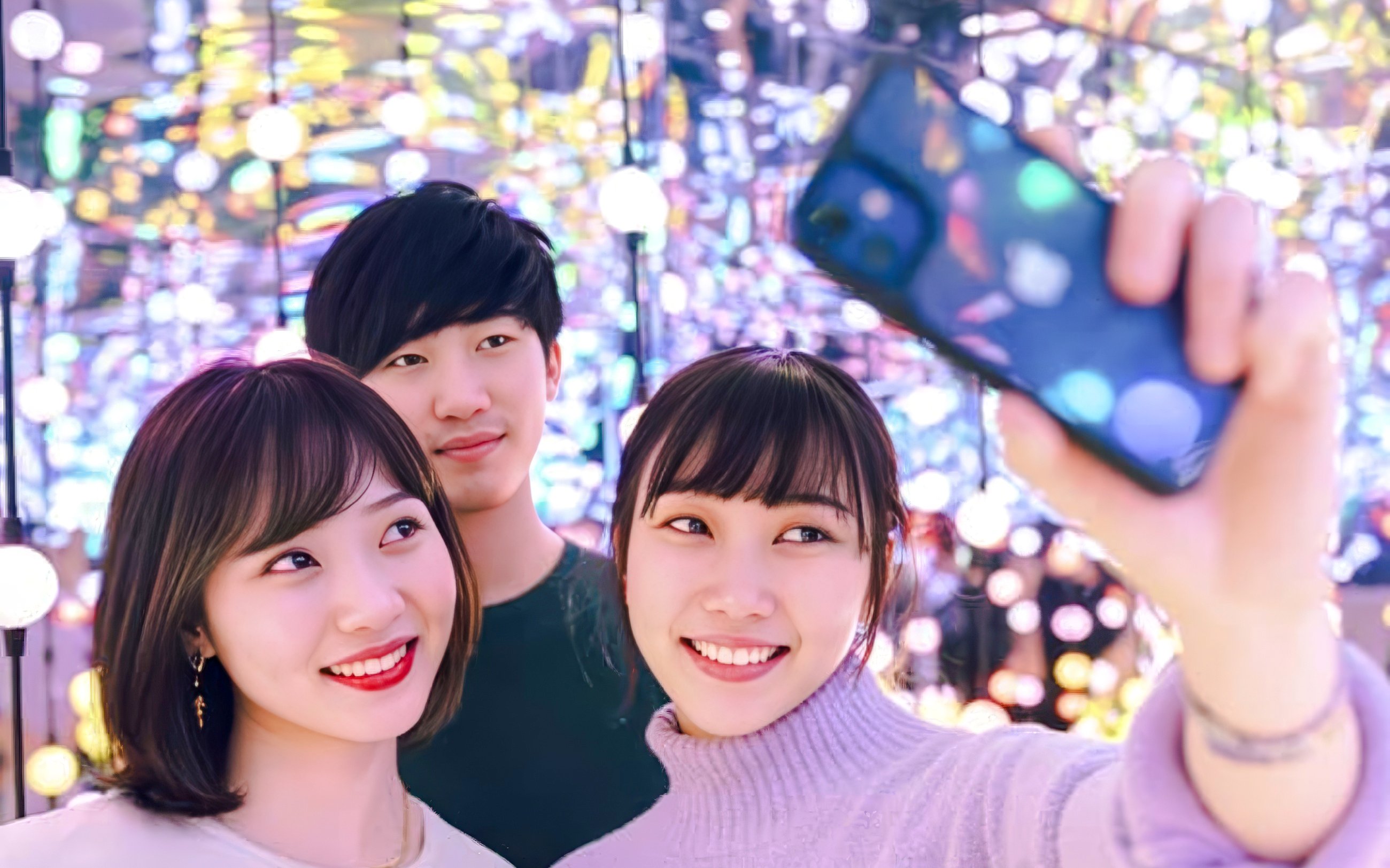 Group of friends taking a selfie at Dopamine Land multisensory experience.