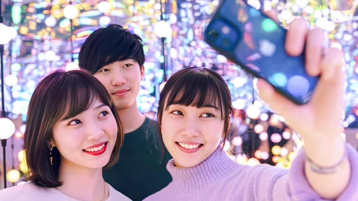 Group of friends taking a selfie at Dopamine Land multisensory experience.