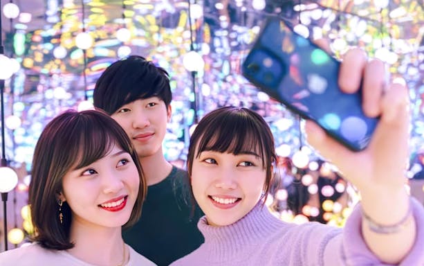 Group of friends taking a selfie at Dopamine Land multisensory experience.