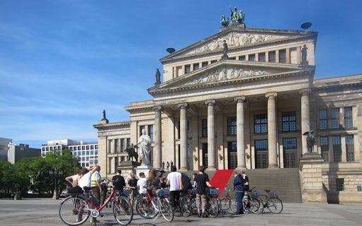 Cyclists gather in front of Berlin's Konzerthaus during a guided bike tour.