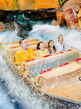 Visitors enjoying a water ride at Dunia Fantasi Dufan Theme Park, Jakarta.