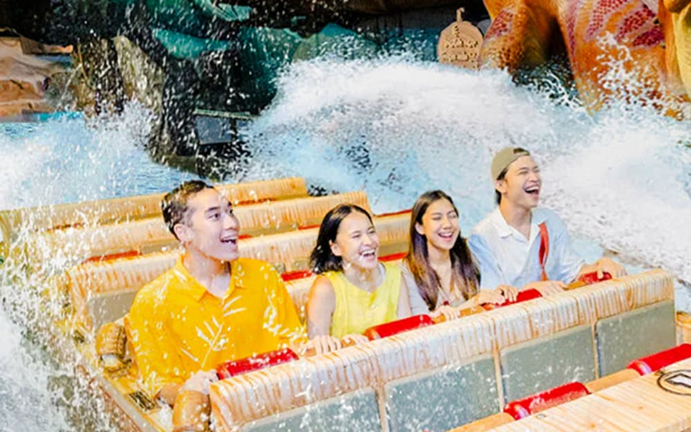 Visitors enjoying water rides at Dunia Fantasi Dufan Theme Amusement Park, Jakarta.