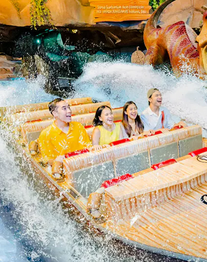 Visitors enjoying a water ride at Dunia Fantasi Dufan Theme Park, Jakarta.