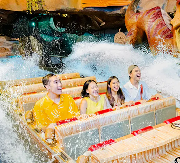 Visitors enjoying a water ride at Dunia Fantasi Dufan Theme Park, Jakarta.