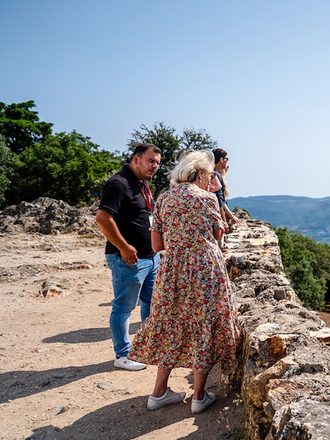 Tourists enjoying panoramic views at a scenic viewpoint in Douro Valley, Portugal.