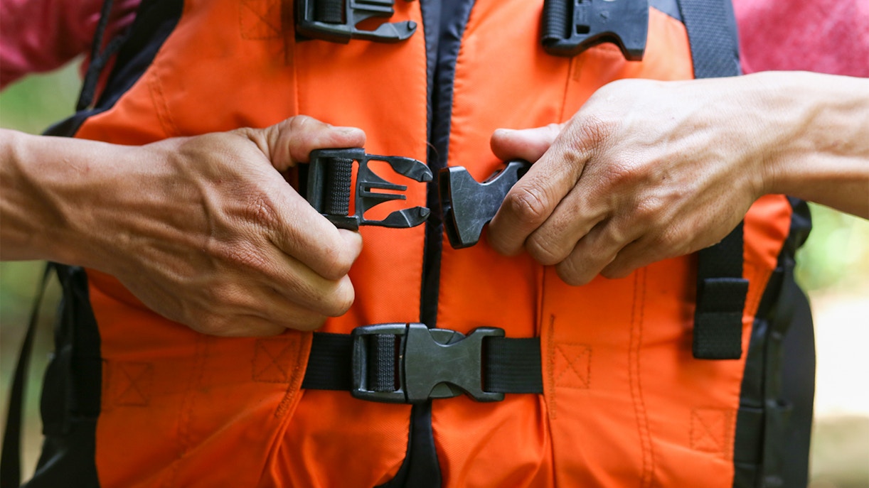 Securing a life jacket buckle at Laguna Waterpark.