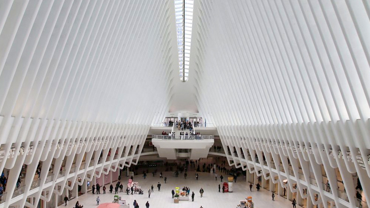 Ground Zero guided tour with visitors at 9/11 Memorial, New York City.