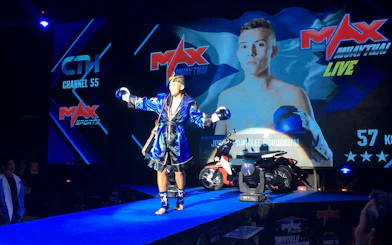 Muay Thai fighter celebrating victory at MAX Muay Thai Stadium Pattaya.