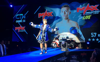 Muay Thai fighter celebrating victory at MAX Muay Thai Stadium Pattaya.