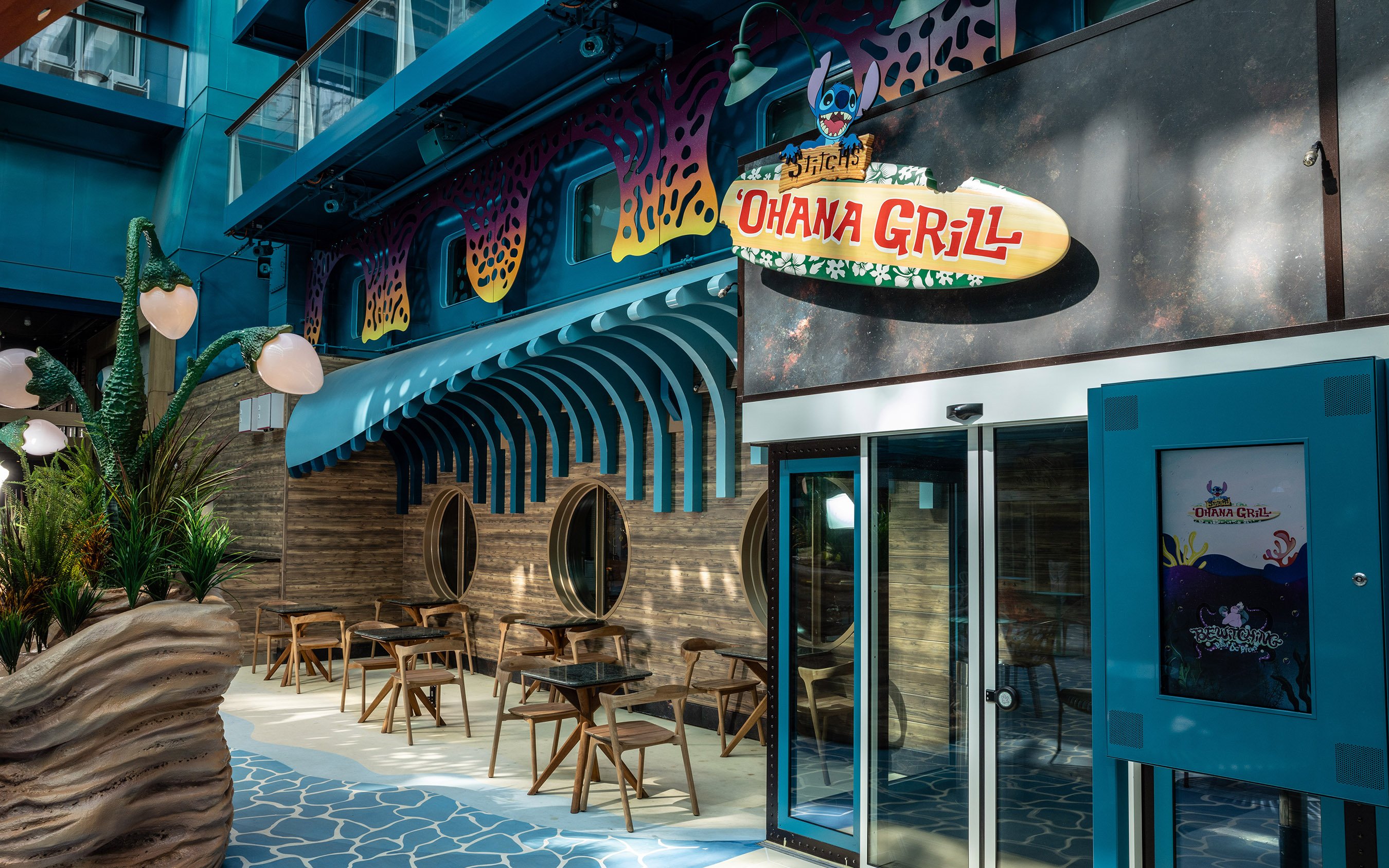 Stitch's Ohana Grill entrance on Disney Cruise Line with themed decor and seating area.