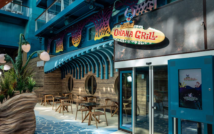 Stitch's Ohana Grill entrance on Disney Cruise Line with themed decor and seating area.