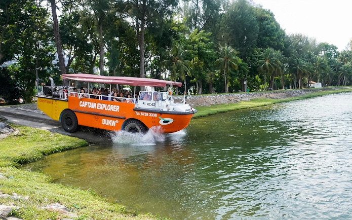 Captain Explorer DUKW vehicle entering water on a scenic tour.