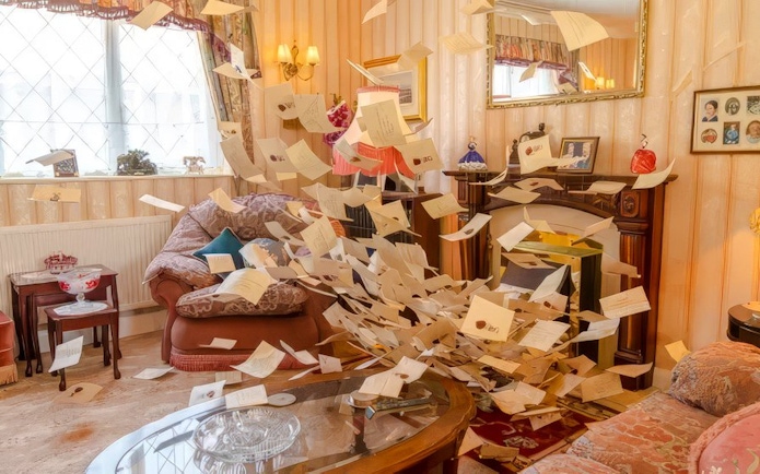 Letters from Hogwarts fill the Dursley living room at Privet Drive.