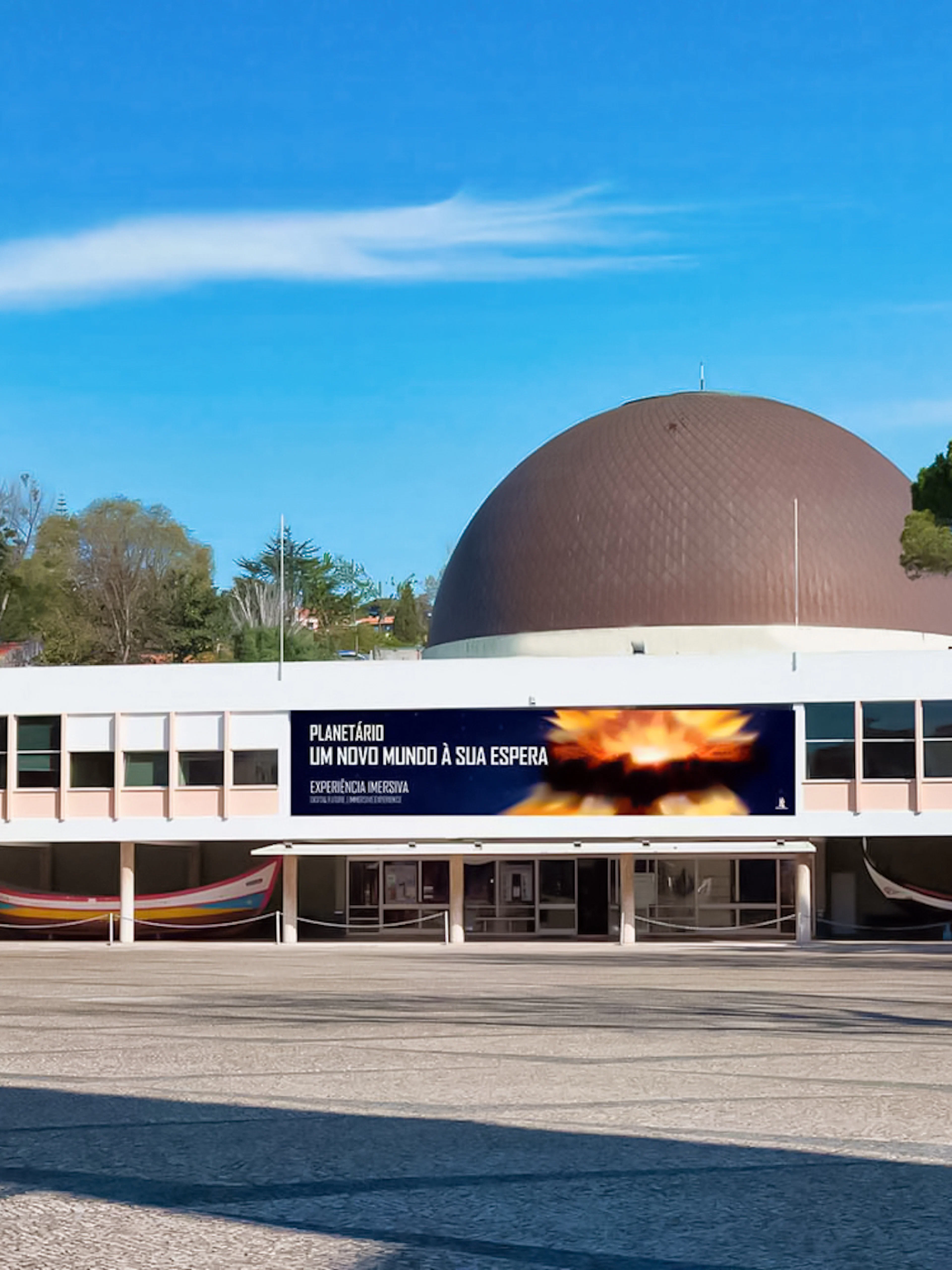 Navy Planetarium building with a large dome and surrounding trees.