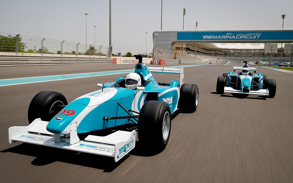 Race cars on Yas Marina Circuit track during FORMULA YAS 3000 Driving Experience, Dubai.