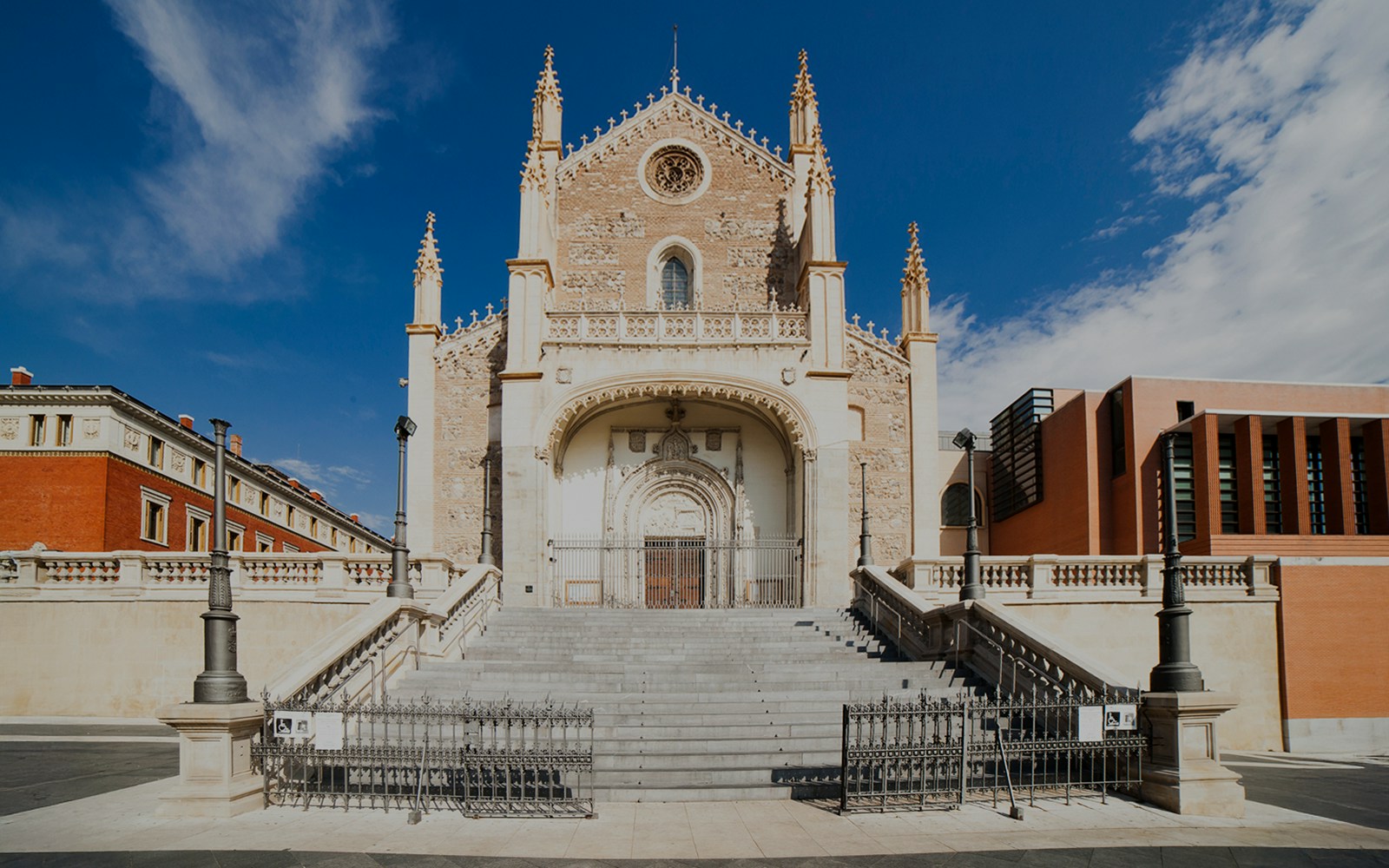 Los Jeronimos Church facade with ornate entrance and steps in Madrid, Spain.