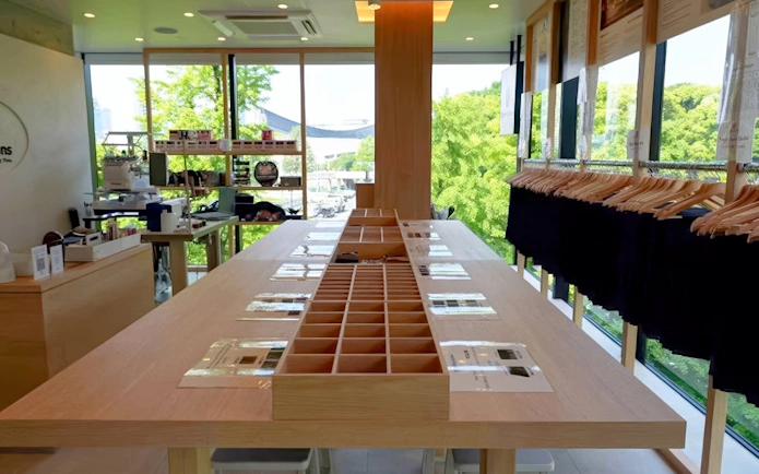 Denim workshop interior with sewing stations and fabric samples, Harajuku, Tokyo.