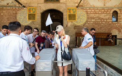 Visitors entering Topkapi Palace during a guided tour in Istanbul.