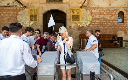 Visitors entering Topkapi Palace during a guided tour in Istanbul.