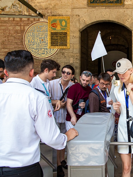 Visitors entering Topkapi Palace during a guided tour in Istanbul.