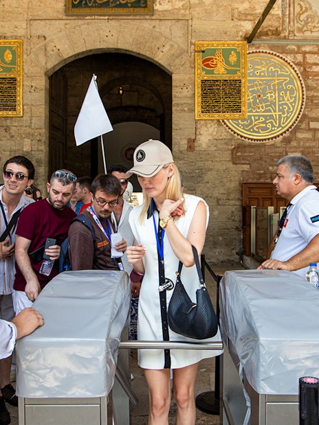 Visitors entering Topkapi Palace during a guided tour in Istanbul.