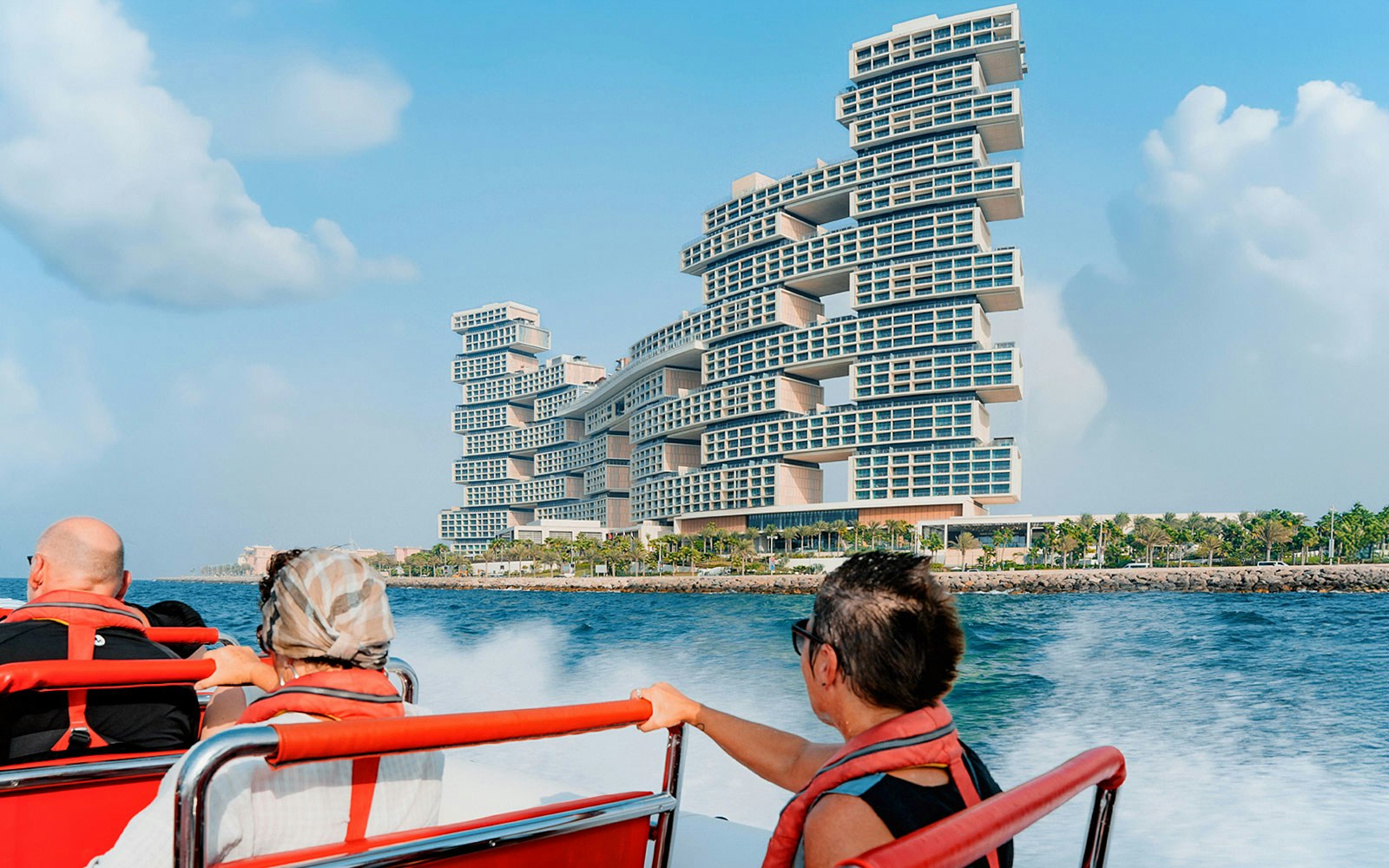 Speedboat cruising past Dubai Marina with views of Atlantis, Palm Jumeirah, and Burj Al Arab.