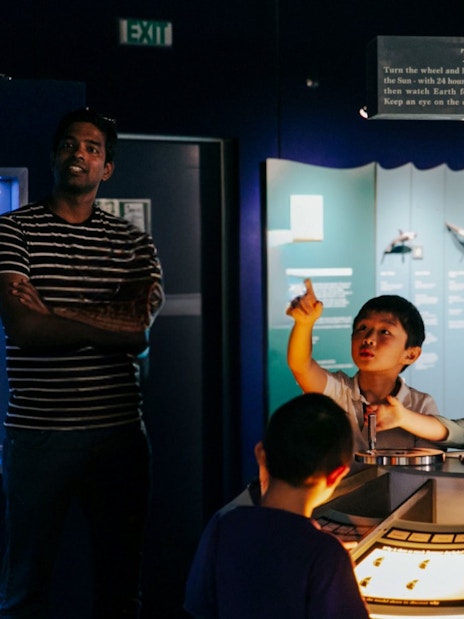Children engaging with "The Orrery" exhibit at the International Antarctic Centre, Christchurch.