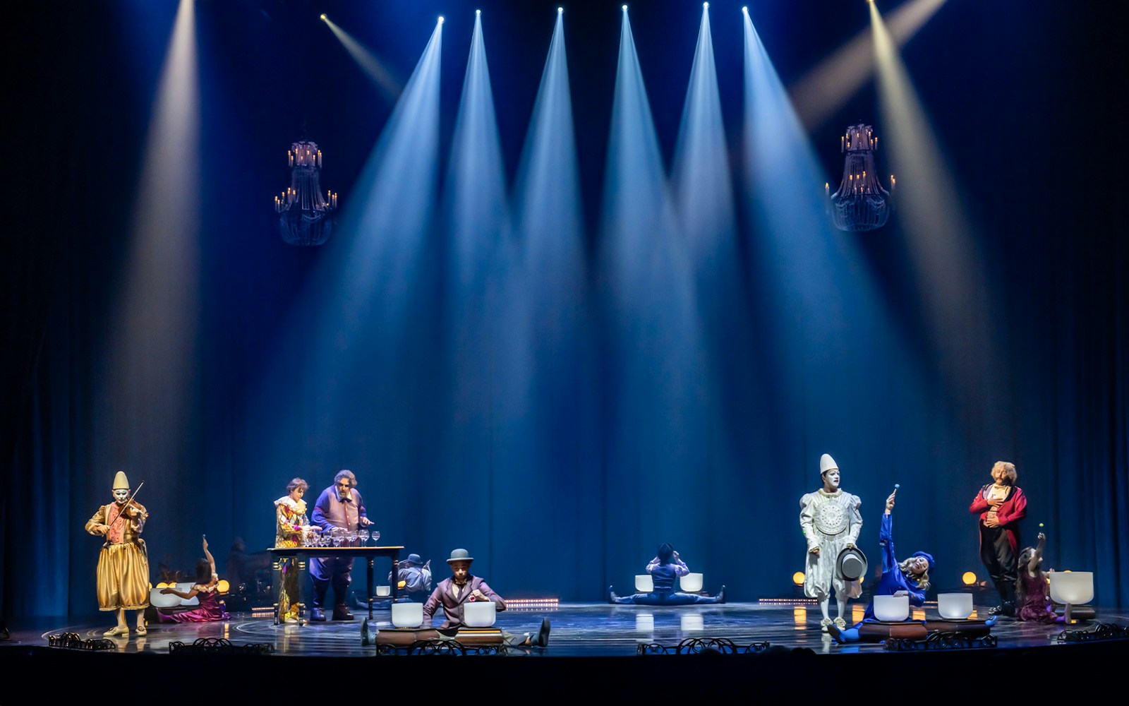 Performers in vibrant costumes on stage during Cirque du Soleil: Corteo show.