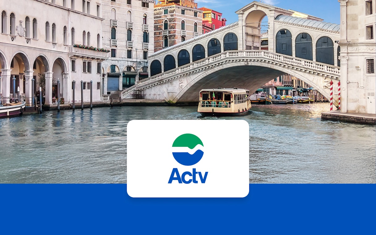Venice ACTV water taxi near Rialto Bridge on the Grand Canal.