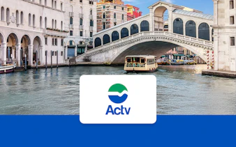 Venice ACTV water taxi near Rialto Bridge on the Grand Canal.