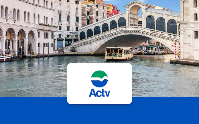 Venice ACTV water taxi near Rialto Bridge on the Grand Canal.