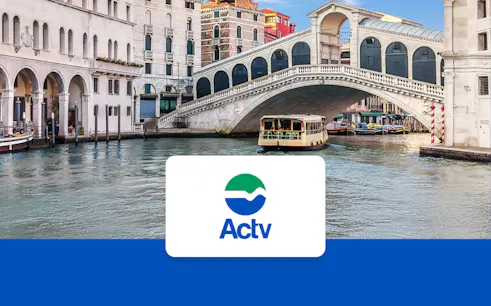 Venice ACTV water taxi near Rialto Bridge on the Grand Canal.