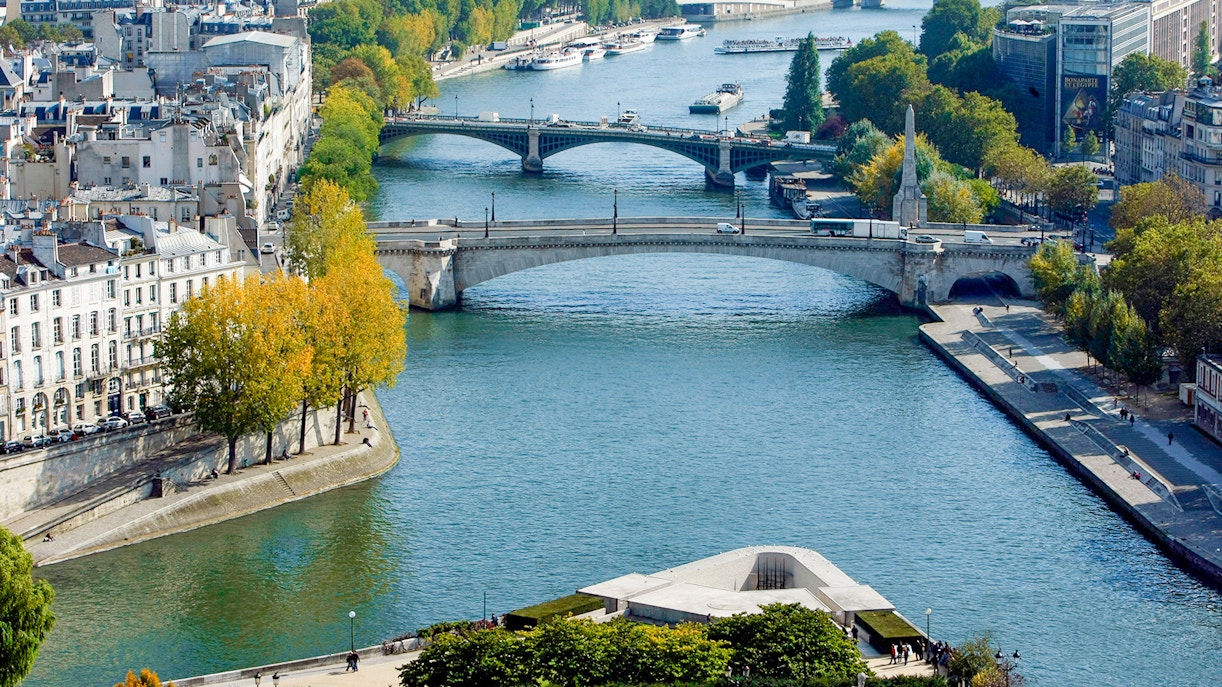 Aerial shot of the Seine River showing its route amidst the bustling city of Paris.