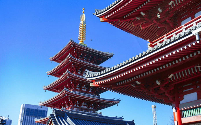 Pagoda and temple roof in Asakusa, Tokyo, part of the Shitamachi Heritage Walking Tour.